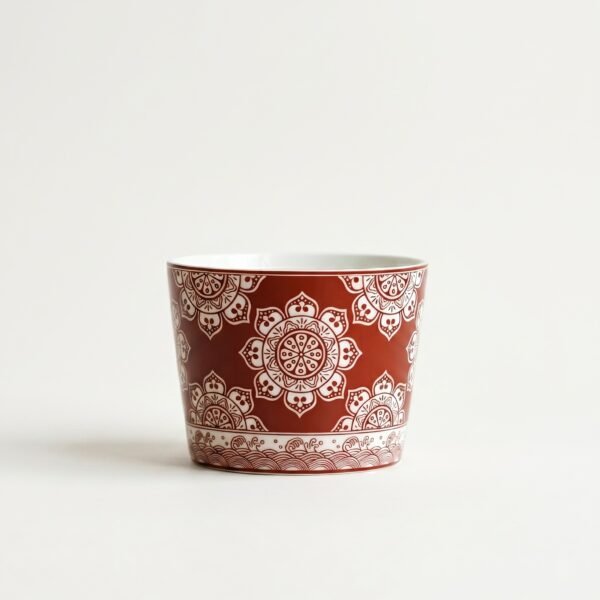 mandala-ceramic-coffee-mug Vintage ceramic mug featuring a detailed bohemian mandala pattern and wave border, isolated on studio white background.